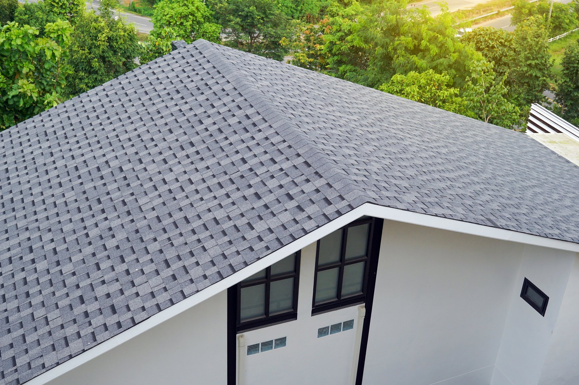 Completed residential roof replacement with new asphalt shingles